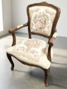 A French-style open salon armchair in needlework upholstery, width 58 cm.