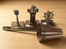 Three miniature models made from salvaged ship parts including a miniature ship's telegraph,
