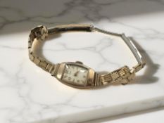 A lady's 9ct gold Trebex wristwatch on gilt-metal bracelet