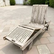 A weathered teak adjustable sun lounger bed, length 200 cm.