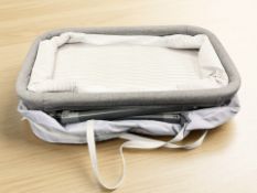 A portable baby hamper, with carry bag.