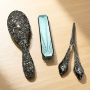 An embossed silver backed dressing table hair brush, length 24 cm,