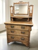 An Art Nouveau oak mirror-back dressing chest, 92 cm x 50 cm x 154 cm.