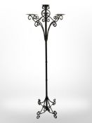 A contemporary wrought metal candle stand, height 173 cm.