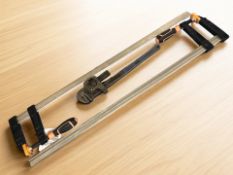 Two Magnusson F-clamps, together with a monkey wrench.