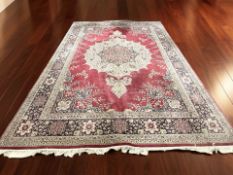 A machine-made carpet of Iranian design,