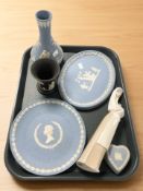 A Nao figure of a woman holding a rabbit and five various pieces of Wedgwood blue and black