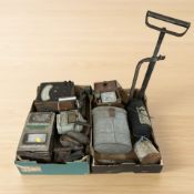 A collection of various instruments and gauges, irons, metal canteen, etc.