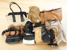 A collection of lady's handbags and shoulder bags including Michael Kors, DKNY, etc.