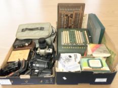 A vintage calculator, assorted cameras including Nikon, Auto bridge playing board.