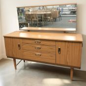 A Schreiber teak mirror-back dressing chest, 138 cm x 45 cm x 120 cm.