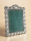 An antique silver mounted easel photo frame, height 19 cm.