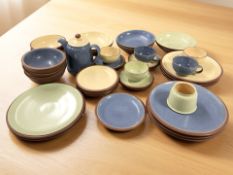 A collection of Denby Pottery table wares in various colours.
