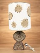 A 1970's pottery table lamp with shade, height 73 cm overall.