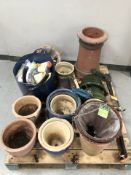 A quantity of ceramic garden plant pots, hand tools, etc.