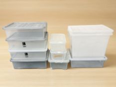 A quantity of plastic storage boxes with lids, longest 60 cm.
