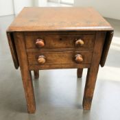 A Victorian mahogany two drawer flapsided table, height 66 cm.