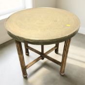 A beech occasional table with Islamic embossed circular top, diameter 60 cm.