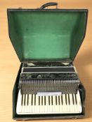 A Scandalli Italian piano accordion, in carry case.