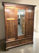 A late Victorian mahogany and satinwood inlaid triple door wardrobe,