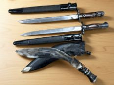 A British SMLE Mk II bayonet in scabbard, another similar,