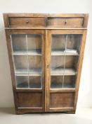 A 1920's oak and leaded glass double door bookcase, width 90 cm.