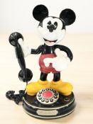 A reproduction Mickey Mouse novelty telephone.