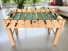 A table football set, length 122 cm.