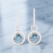 A pair of blue diamond cluster earrings,