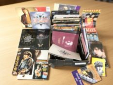A collection of music books and publications including The Beatles,