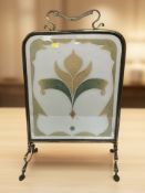An Art Nouveau brass and glass fire screen, height 70 cm.