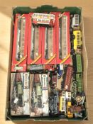 A quantity of rolling stock including Hornby, die cast trams, Kitmaster locomotive model kits.