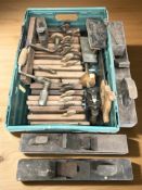 A collection of vintage woodworking planes including Stanley, a clamp, saw, hand drill, etc.