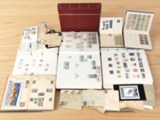 A group of stamp albums and postcards.
