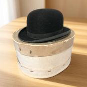 A gent's black felt bowler hat marked 'Lincoln Bennett & Co', with a hat box.