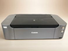 A Canon Pro 100S printer.