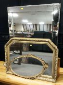 A contemporary un-framed mirror,