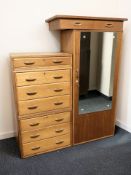 A 20th century teak single door cabinet with hanging space to interior,