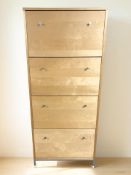A modern pine effect shoe cabinet, width 69 cm.