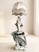 A modern glass topped coffee table in the form of a wolf, height 50 cm,