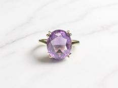 A 9ct yellow gold dress ring set with an amethyst, size P. CONDITION REPORT: 4.3g.