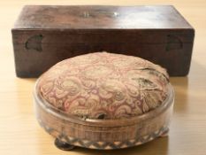 A Victorian circular footstool and an antique box containing a quantity of cutlery