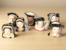 A set of seven Royal Doulton character jugs modelled as Henry VIII and his six wives, height 10 cm.