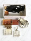 A group of opened fragrances and perfumes