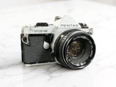 A Pentax ME Super 35mm film camera, with SMC Pentax-M 1:2 50mm lens.