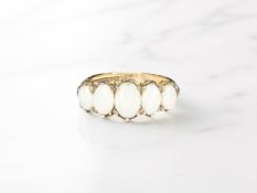 A 9ct gold five stone opal ring, size O CONDITION REPORT: 4.