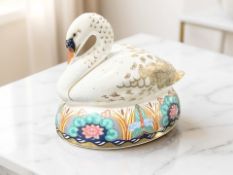 A Royal Crown Derby Nesting Swan paperweight, gold stopper.
