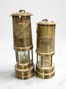 An E Thomas & Williams Limited brass miner's safety lamp, plus another Welsh lamp.