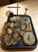 A gilt metal floral wall sconce, a small EPNS dinner gong, a brass sun dial,