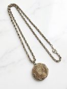A 9ct gold necklace, length 56 cm, with suspended rolled gold circular locket.